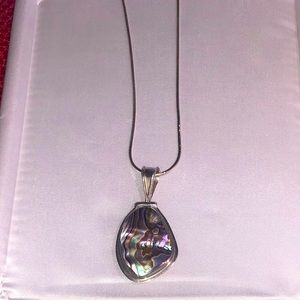 Necklace, sterling silver.  Two different sides